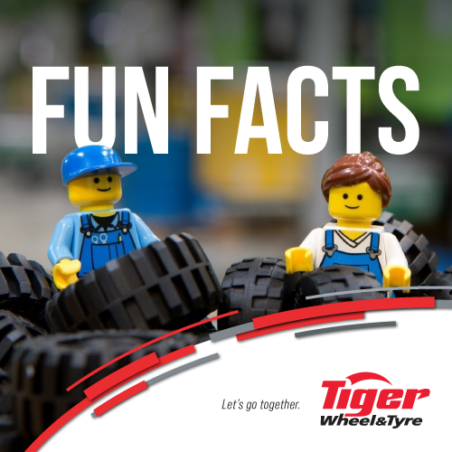 lego people standing amongst lego tyres